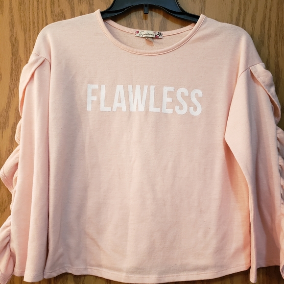 Cute light pink, long sleeve blouse with flawless on front. Excellent condition. - Picture 1 of 5
